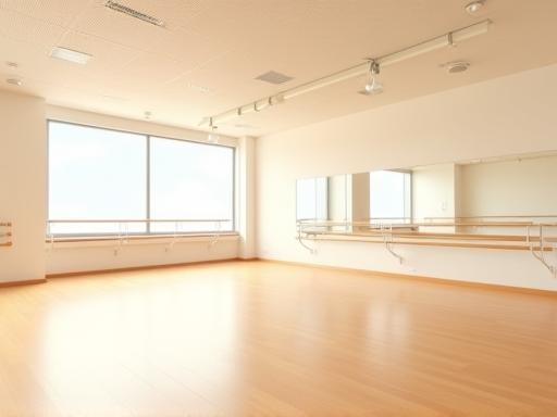 Bright, spacious dance studio interior with polished wooden floor and mirrors in Shibuya, Tokyo.